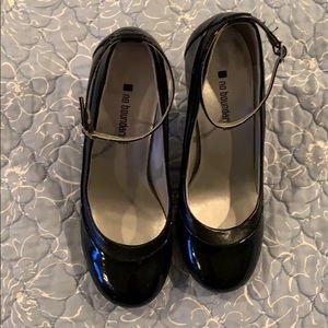 Black Patent leather heels with strap.